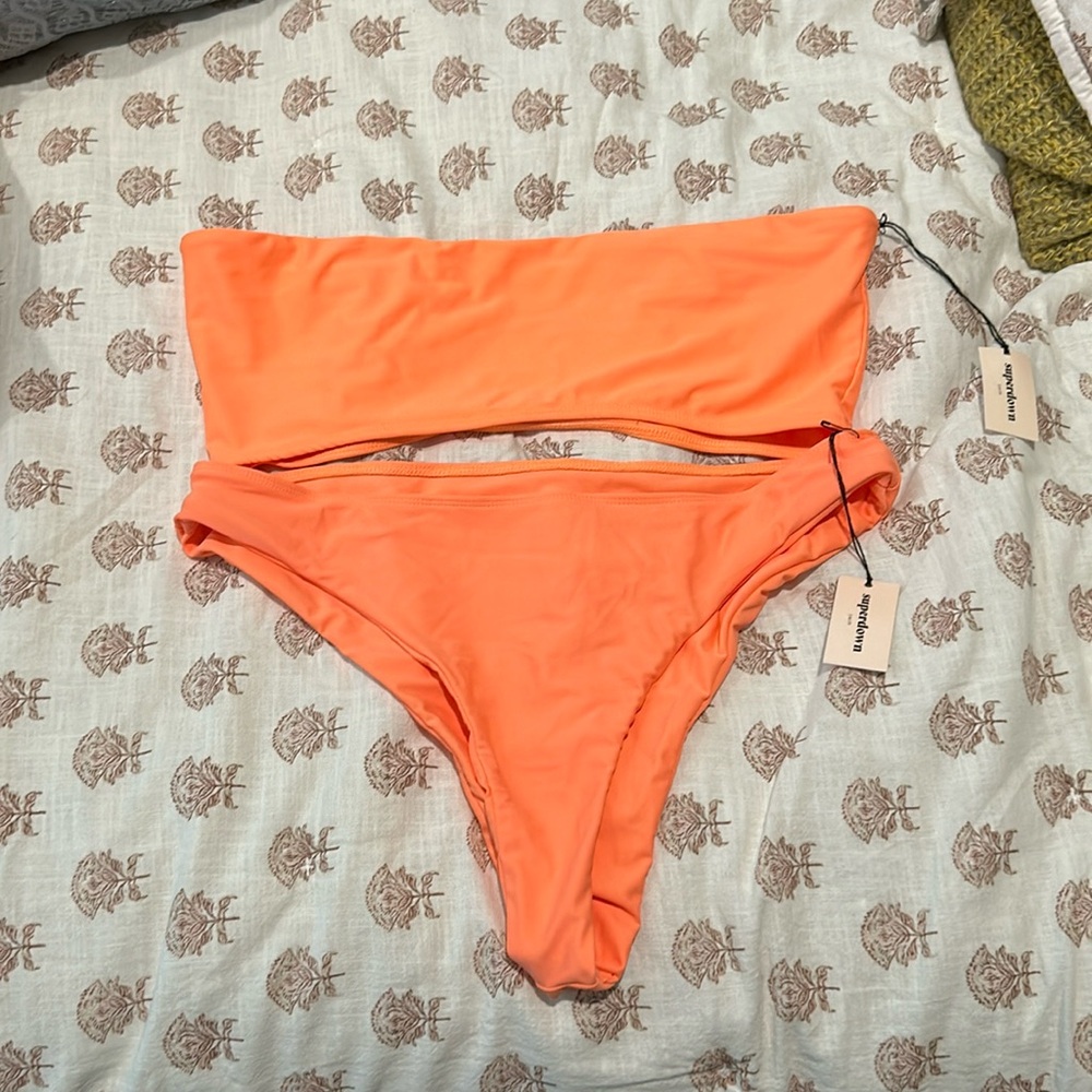 New with tags, never worn, and Selling as a set both top and bottom together.